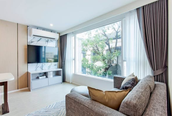 bedroom and living room of C Ekkamai Condominium