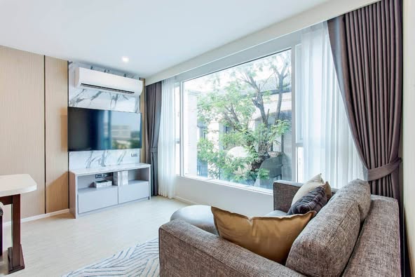 bedroom and living room of C Ekkamai Condominium