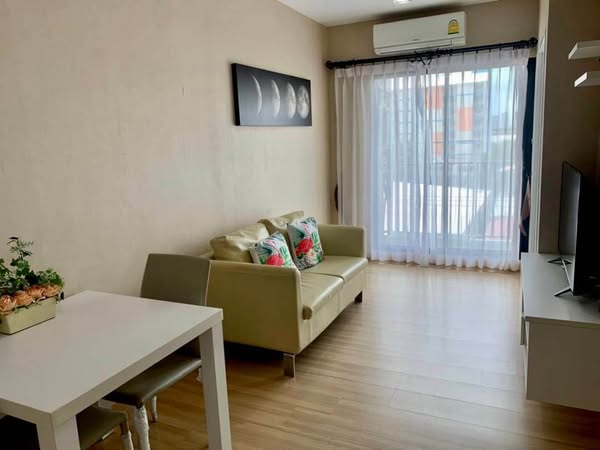 living room and bedroom of Dezone Condo