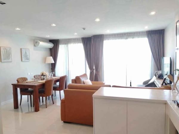 living room and bedroom of Jomtien Condotel - B