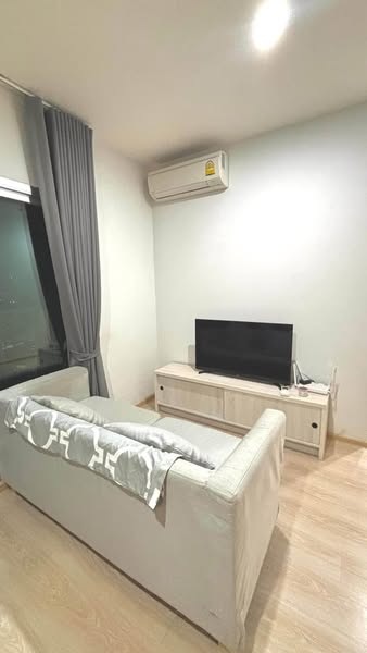 living room and bedroom of Noble Revolve Ratchada 1