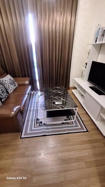 bedroom and living room of S&S Sukhumvit Condominium