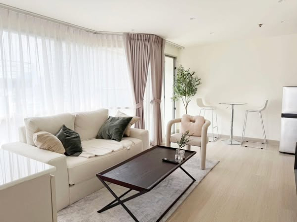 bedroom and living room of Sukhumvit Suites Hotel
