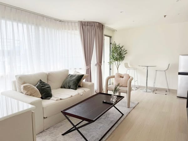 bedroom and living room of Sukhumvit Suites Hotel