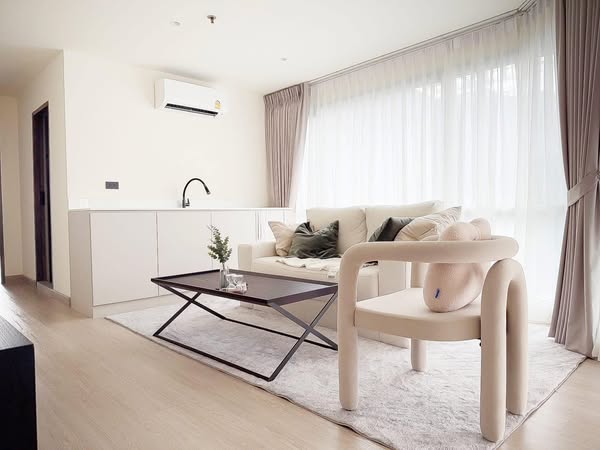 living room and bedroom of Sukhumvit Suites Hotel