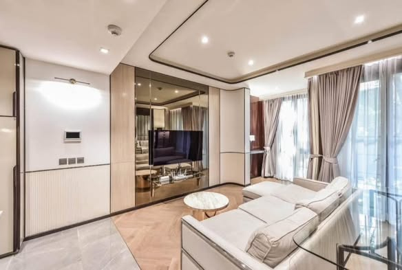 living room and bedroom of The Reserve Sukhumvit 61