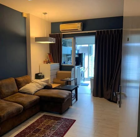 bedroom and living room of The Room Ratchada-Ladprao