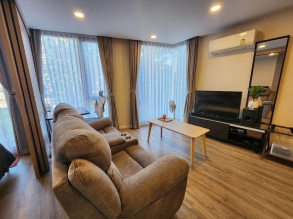 bedroom and living room of The TEAK Sathon-Lumphini